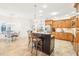 Open concept kitchen with granite counters and island at 8831 Bel Meadow Way, Trinity, FL 34655