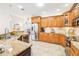 Modern kitchen boasting stainless steel appliances and granite countertops at 8831 Bel Meadow Way, Trinity, FL 34655