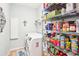 Convenient laundry room with washer, dryer, and ample storage at 8831 Bel Meadow Way, Trinity, FL 34655