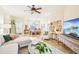 Spacious living room with sectional sofa and large TV at 8831 Bel Meadow Way, Trinity, FL 34655