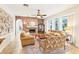 Cozy living room featuring a brick fireplace and ample seating at 8831 Bel Meadow Way, Trinity, FL 34655