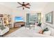 Bright and airy living room with comfortable seating and a large TV at 8831 Bel Meadow Way, Trinity, FL 34655