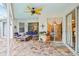 Covered patio with seating and ceiling fan at 8831 Bel Meadow Way, Trinity, FL 34655
