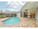 Inviting screened pool and patio area with seating at 8831 Bel Meadow Way, Trinity, FL 34655