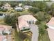Aerial view of house with driveway and surrounding landscape at 9090 Alexandria Dr, Weeki Wachee, FL 34613