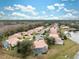Aerial view of neighborhood with lake and conservation area at 9090 Alexandria Dr, Weeki Wachee, FL 34613
