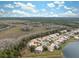 Aerial view of neighborhood with lake and conservation area at 9090 Alexandria Dr, Weeki Wachee, FL 34613