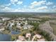 Aerial view of a community with several houses and green spaces at 9090 Alexandria Dr, Weeki Wachee, FL 34613