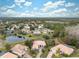 Aerial view of a house and surrounding neighborhood at 9090 Alexandria Dr, Weeki Wachee, FL 34613