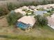 Aerial view of home with pool and fenced enclosure at 9090 Alexandria Dr, Weeki Wachee, FL 34613