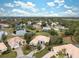 Aerial view showcasing a house in a community near a lake at 9090 Alexandria Dr, Weeki Wachee, FL 34613