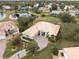 Aerial view of a single-Gathering home in a residential area at 9090 Alexandria Dr, Weeki Wachee, FL 34613