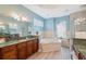 Spa-like bathroom with double vanities and a corner tub at 9090 Alexandria Dr, Weeki Wachee, FL 34613