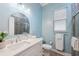 Clean bathroom with a toilet, vanity, and walk-in shower at 9090 Alexandria Dr, Weeki Wachee, FL 34613