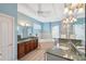 Elegant bathroom with double sinks, soaking tub, and walk-in shower at 9090 Alexandria Dr, Weeki Wachee, FL 34613