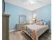 Serene bedroom featuring a queen bed and light blue walls at 9090 Alexandria Dr, Weeki Wachee, FL 34613