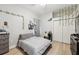 Cozy bedroom with a full-size bed, dresser, and window at 9090 Alexandria Dr, Weeki Wachee, FL 34613