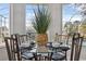 Glass-topped breakfast table with four chairs, overlooking pool at 9090 Alexandria Dr, Weeki Wachee, FL 34613
