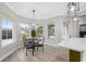 Bright breakfast nook with glass table and view of pool at 9090 Alexandria Dr, Weeki Wachee, FL 34613