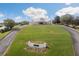Community clubhouse with landscaped grounds and a welcoming entrance at 9090 Alexandria Dr, Weeki Wachee, FL 34613