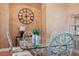Formal dining room featuring a glass-top table and ornate chairs at 9090 Alexandria Dr, Weeki Wachee, FL 34613