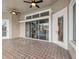Enclosed patio with pool view, tile flooring, and access to interior at 9090 Alexandria Dr, Weeki Wachee, FL 34613