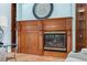 Living room fireplace with ornate wooden mantel at 9090 Alexandria Dr, Weeki Wachee, FL 34613