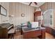 Home office with built-in cabinetry and wood desk at 9090 Alexandria Dr, Weeki Wachee, FL 34613