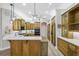 Updated kitchen featuring wood cabinets and quartz countertops at 9090 Alexandria Dr, Weeki Wachee, FL 34613