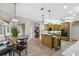 Eat-in kitchen with island, wood cabinets and breakfast nook at 9090 Alexandria Dr, Weeki Wachee, FL 34613