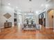 Spacious living room with tile floors, fireplace, and large windows at 9090 Alexandria Dr, Weeki Wachee, FL 34613