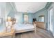 Bright main bedroom with wood floors and large windows at 9090 Alexandria Dr, Weeki Wachee, FL 34613