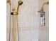 Bathroom featuring a shower with gold fixtures and built-in storage niche at 9090 Alexandria Dr, Weeki Wachee, FL 34613