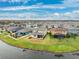 Aerial view of a lakefront community with numerous houses at 9173 Shadyside Ln, Land O Lakes, FL 34637