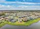 Aerial view of a large residential neighborhood near a lake at 9173 Shadyside Ln, Land O Lakes, FL 34637
