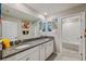 Double vanity bathroom with granite countertops at 9173 Shadyside Ln, Land O Lakes, FL 34637