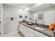 Double vanity bathroom with granite countertops and mirror at 9173 Shadyside Ln, Land O Lakes, FL 34637