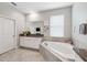 Bathroom boasts a corner soaking tub, double vanity, and a large mirror at 9173 Shadyside Ln, Land O Lakes, FL 34637