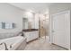 Elegant bathroom with soaking tub, shower, and double vanity at 9173 Shadyside Ln, Land O Lakes, FL 34637