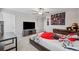 Bright bedroom featuring a TV and ample closet space at 9173 Shadyside Ln, Land O Lakes, FL 34637