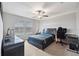 Bedroom with a desk and gaming chair setup at 9173 Shadyside Ln, Land O Lakes, FL 34637