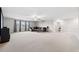 Spacious bonus room with large windows and ceiling fan at 9173 Shadyside Ln, Land O Lakes, FL 34637
