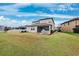 Two-story house with screened lanai and backyard at 9173 Shadyside Ln, Land O Lakes, FL 34637
