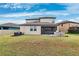 Two-story house with screened lanai and backyard at 9173 Shadyside Ln, Land O Lakes, FL 34637