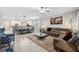Open concept living and kitchen area with large island and comfortable seating at 9173 Shadyside Ln, Land O Lakes, FL 34637