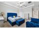 Main bedroom with a blue upholstered bed, two nightstands, and a dresser at 9173 Shadyside Ln, Land O Lakes, FL 34637