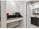 Convenient home office space with built-in desk and adjacent bathroom at 9173 Shadyside Ln, Land O Lakes, FL 34637