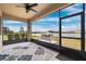 Relaxing screened lanai overlooking a pond with built-in grill at 9173 Shadyside Ln, Land O Lakes, FL 34637