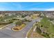 Aerial view of community entrance and homes at 9323 Bella Vita Cir, Land O Lakes, FL 34637