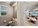 Small powder room with single sink vanity and neutral color scheme at 9323 Bella Vita Cir, Land O Lakes, FL 34637